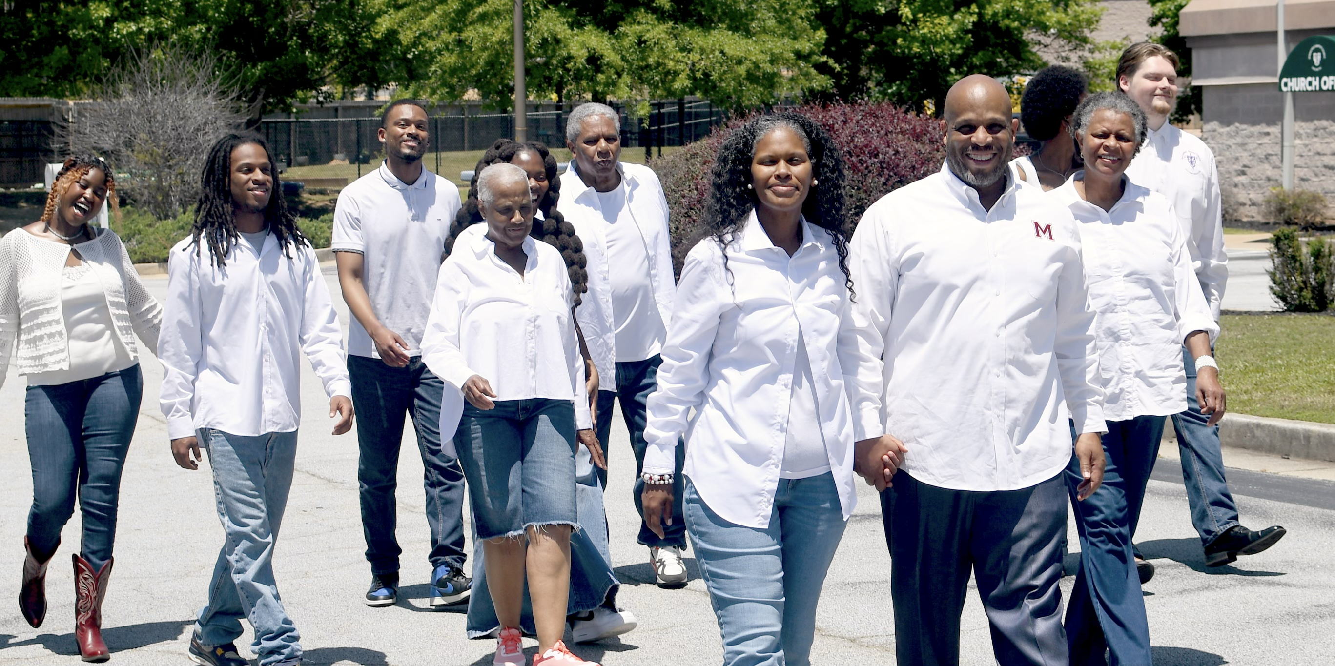 Pastor Eric Lee walking with supporters